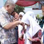 Sekdakab Asahan Serahkan BPJS Kesehatan Gratis dan KIP di 4 Kecamatan